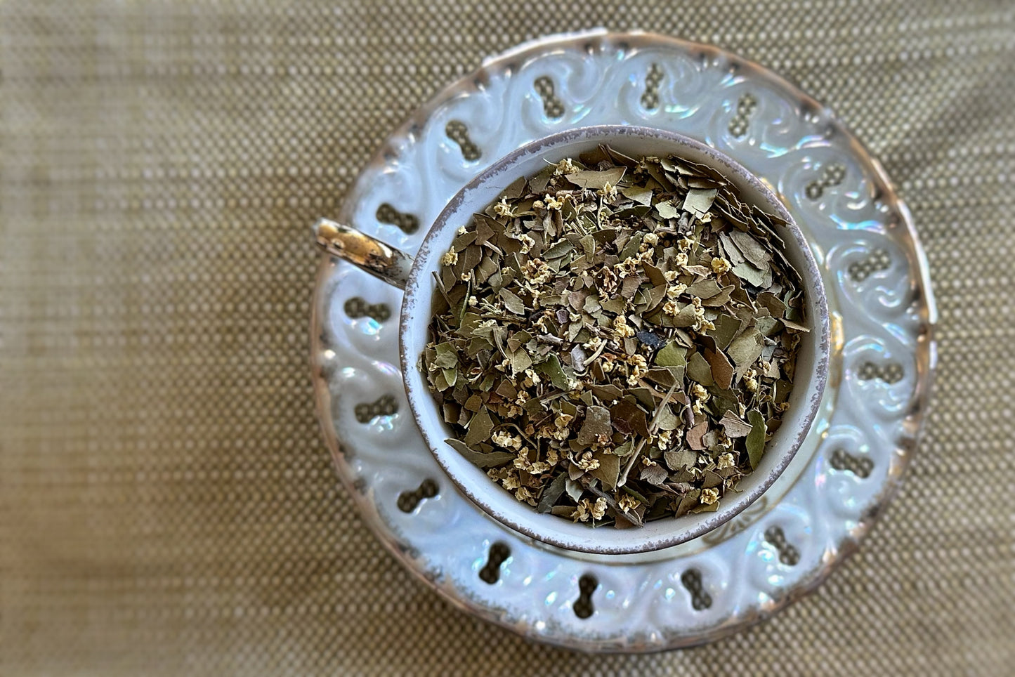 Teacup full of Yaupon Holly leaves and elderflowers