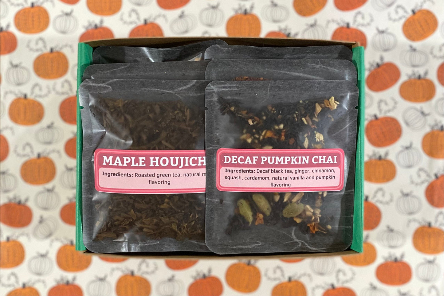 An open fall tea sampler box, showing Decaf Pumpkin Chai and Maple Houjicha