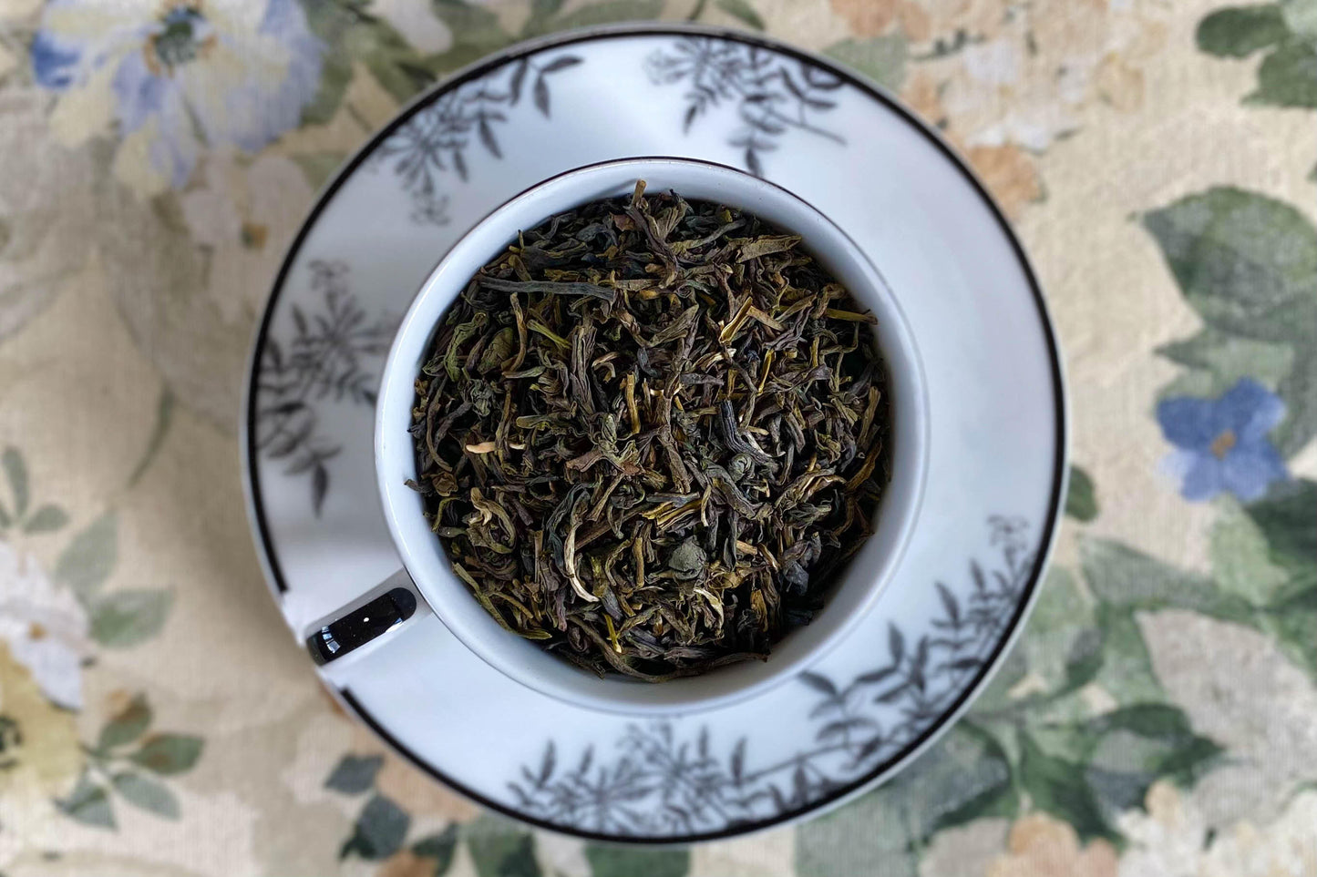 teacup full of green tea