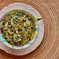 Teacup full of flowers and lemongrass