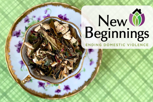 teacup full of white tea and peach with New Beginnings logo