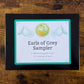 Closed box with label reading "Earls of Grey Sampler: 8 different bergamot teas, 3-5 servings of each