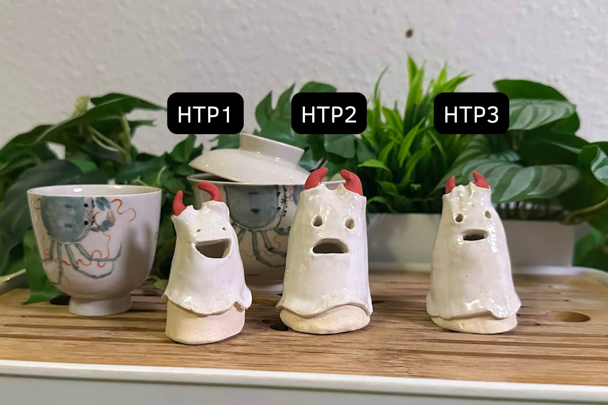 Three demon tea pets with ghost sheets over them and little red demon horns poking out the top. They are labeled HTP1, HTP2 and HTP3