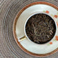 teacup full of brown twiggy leaf