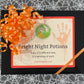 Box of 'Fright Night Potions' with a decorative ribbon on a patterned background