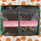 An open fall tea sampler box, showing Decaf Pumpkin Chai and Maple Houjicha