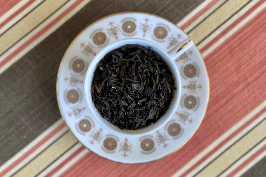 teacup full of black tea