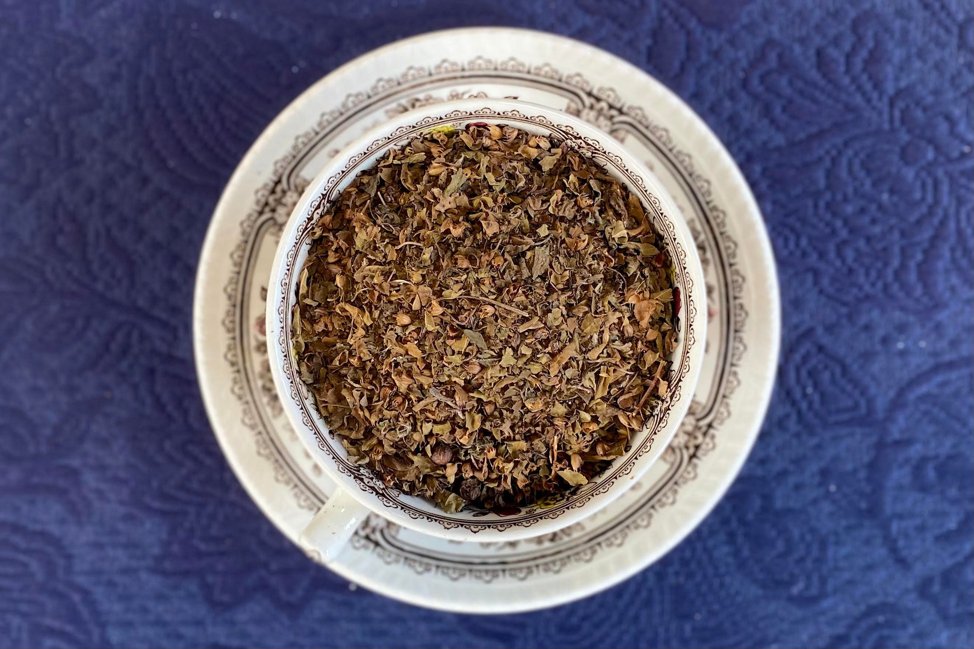 teacup full of tulsi herb