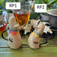 Two pigeon tea pets with rainbow colored ruffs, labeled RP1 and RP2