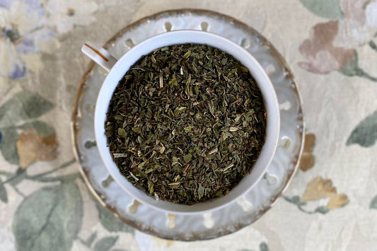 teacup full of cut mint leaf