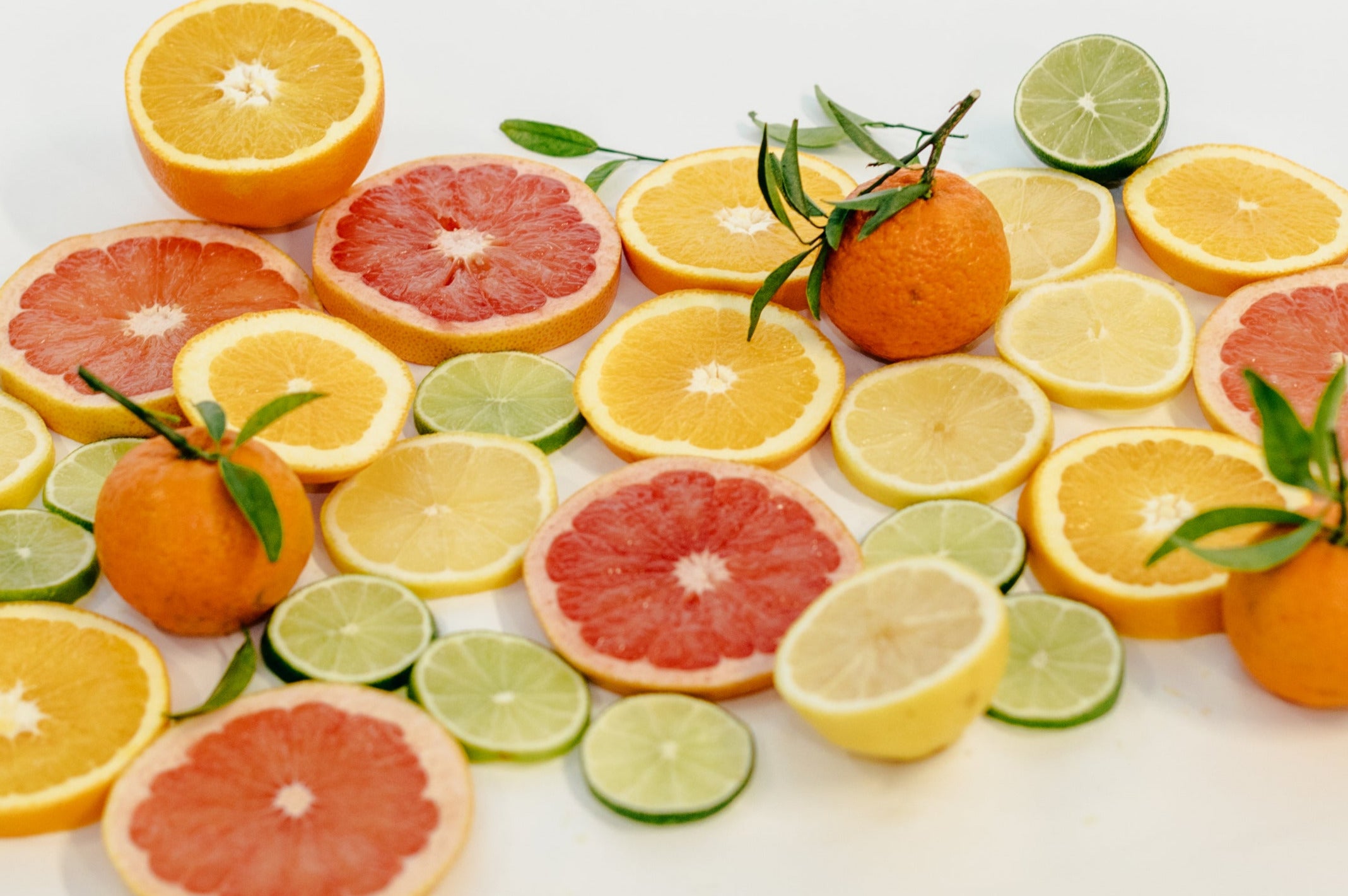 A bunch of sliced citrus fruits
